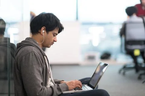 Software developer working on the floor Stock Photos