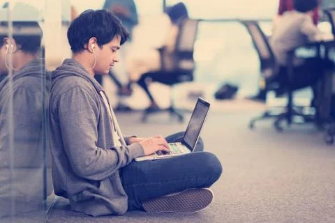 Software developer working on the floor Foto stock