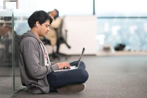 Software developer working on the floor Stock Photos