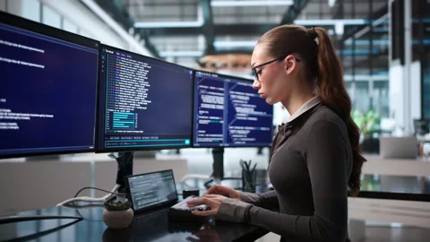 Software Developer Working On Interactive Coding Environment. Stock Footage 345327116