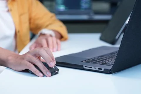 Software Developer Working on Laptop with Computer Mouse Fotos Stock