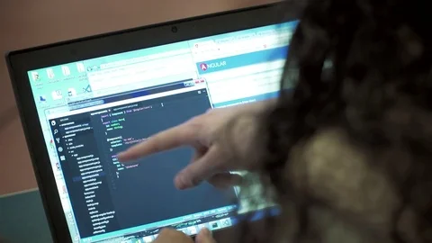 Software developer working on some web development code Stock Footage 74870764