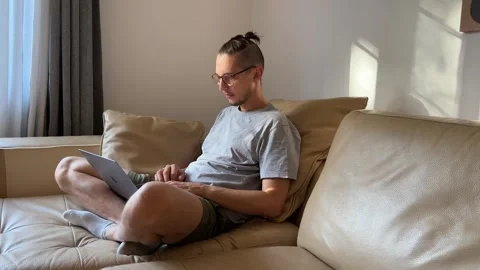 Software developer works and expresses different emotions on his face Stock Footage 253384919