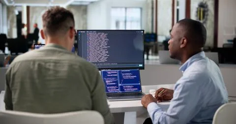 Software Developer Writes Secure Code Using Cloud-based Tools On Laptop. Stock Photos