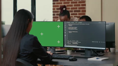 Software developer writing algorithm in front of computer with green screen Stock Footage 168237476