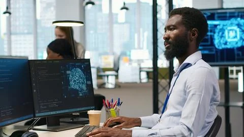 Software developer writing code on PC, developing deep learning APIs 스톡 사진