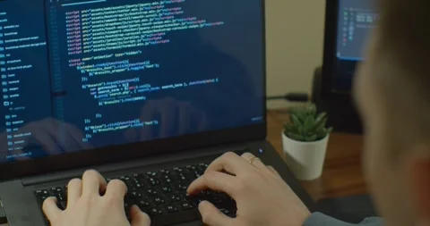 Software developer writing line of source code in personal laptop Stock Footage 334021973