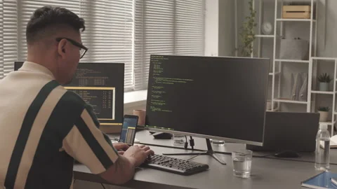 Software Developer Writing Program Code on Computer Stock Footage 195978885