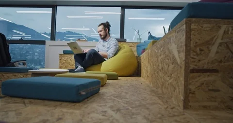 Software developer writing programming code using laptop computer while sitti Stock Footage 114050745