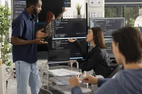 Software developers analyzing HTML scripts at work Foto stock