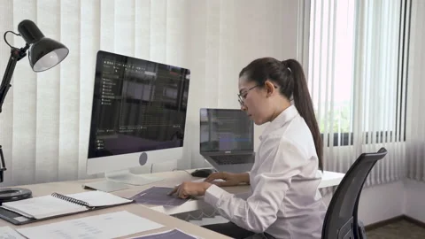 Software developers are analyzing about the code written into the program on  Stock Footage 149465507