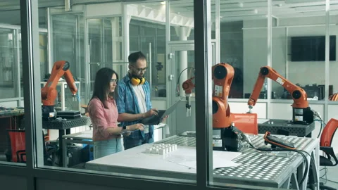 Software developers are holding an experiment with a robot Stock Footage 135588746