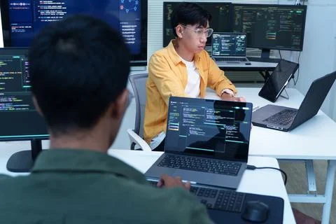 Software Developers Coding in a Technology Workspace Fotos Stock