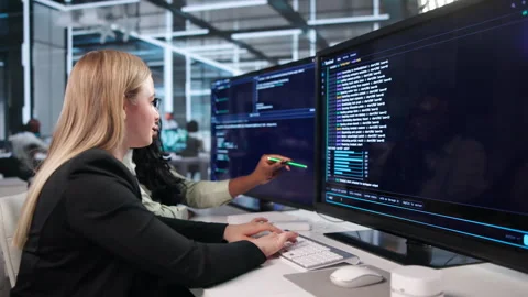Software Developers Collaborate Closely, Coding Together Stock Footage 343885658