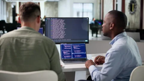 Software Developers Collaborate Closely, Coding And Testing Stock Footage 345311726