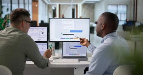 Software Developers Collaborate Closely To Design Intelligent Chatbot Feature 写真素材