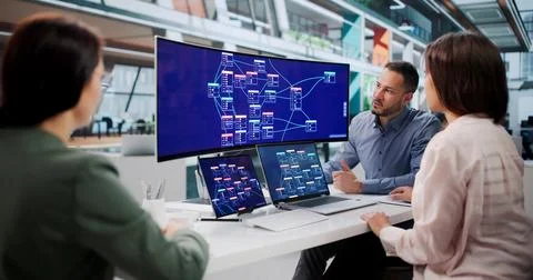 Software Developers Collaborate Closely Using Low Code Visual Workflow Tools. Фото