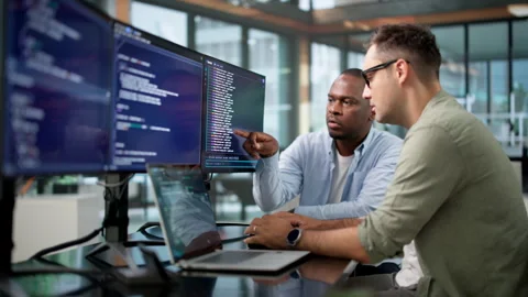 Software Developers Collaborate On Coding Project Stock Footage 346320849