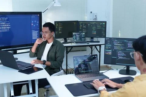 Software Developers Collaborating on AI Programming Projects Photos