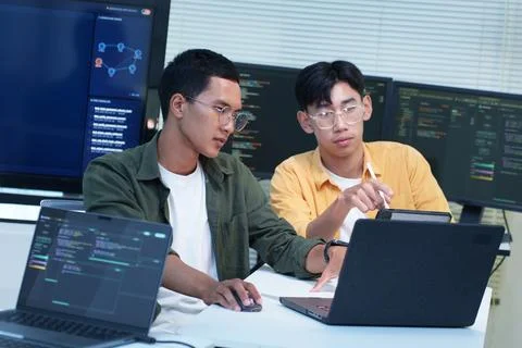 Software Developers Collaborating on AI Technology and Code Stock Photos