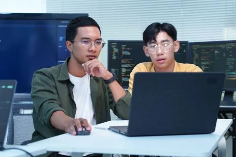 Software Developers Collaborating on AI Technology and Code Stock-Fotos