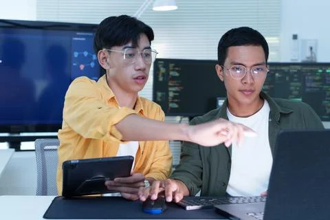 Software Developers Collaborating on AI Technology in Modern Office Stock Photos