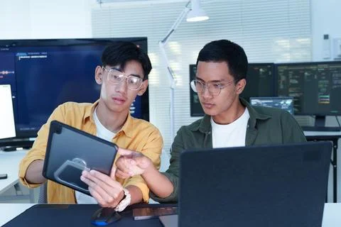 Software Developers Collaborating on AI Technology in Modern Office Stock Photos