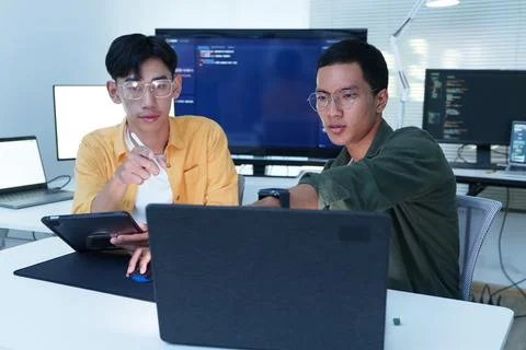 Software Developers Collaborating on Code in Modern Technology Office Stock-Fotos
