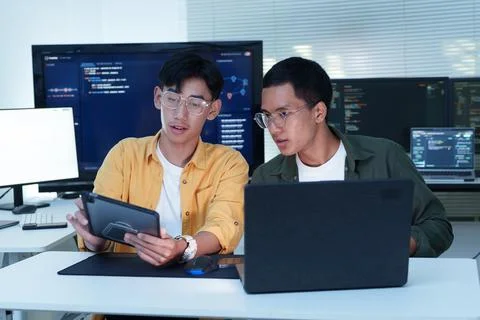 Software Developers Collaborating on Coding and Artificial Intelligence Stock Photos