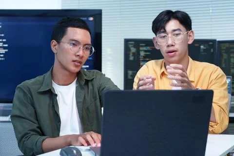 Software Developers Collaborating on Programming Project Stock Photos