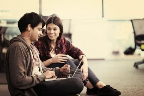 Software developers couple working on the floor 스톡 사진