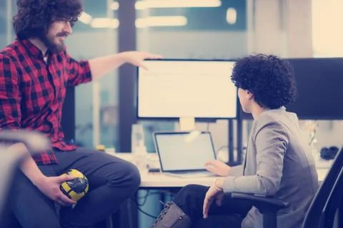 Software developers couple writing programming code Stock Photos