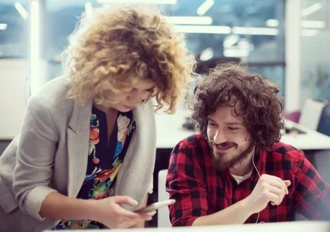 Software developers couple writing programming code Stock Photos
