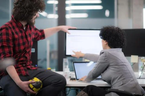 Software developers couple writing programming code Stock Photos