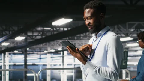 Software developers on data center industrial platform analyzing performance Stock Footage 310277821