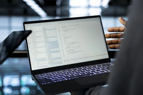 Software developers in data center using laptop and tablet, closeup 스톡 사진