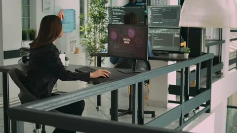 Software developers dealing with hacked online system Stock Footage 220380997