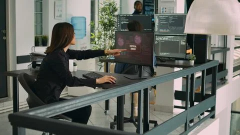 Software developers dealing with hacked online system Stock Photos