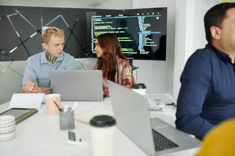Software Developers Discussing Bugs Stock Photos