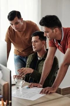 Software Developers Discussing Project Features Stock Photos