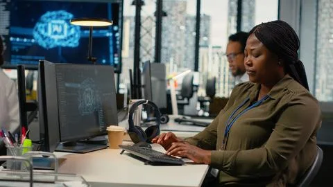 Software developers doing brainstorming in office, using AI specialized hardware Stock Photos
