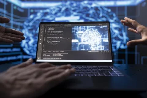 Software developers running AI cognitive computing tech on laptop Foto stock