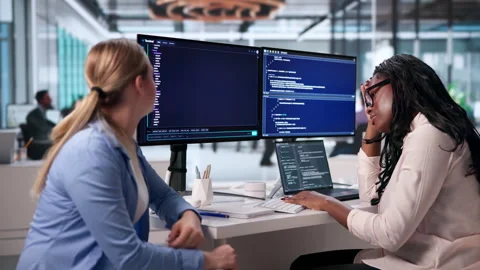 Software Developers Tired And Stressed While Coding Late Video stock 345322527