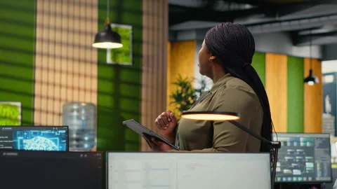 Software developers working in AI startup training predictive models Stock Footage 323143857