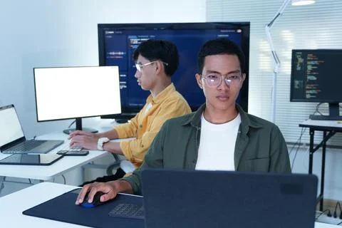 Software Developers Working on AI Technology in Modern Office Stock Photos