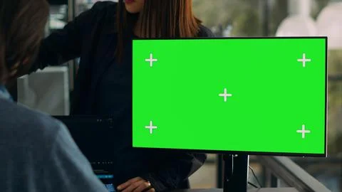 Software developers working on code programming with greenscreen 库存照片