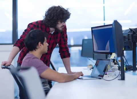 Software developers writing programming code 库存照片