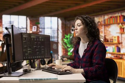 Software development agency IT specialist optimizing code on computer Stock Photos