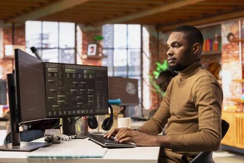 Software development agency worker debugging and optimizing code Stock Photos