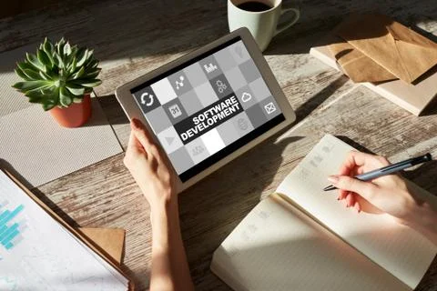 Software development and process automation concept on tablet computer screen. Stock Photos